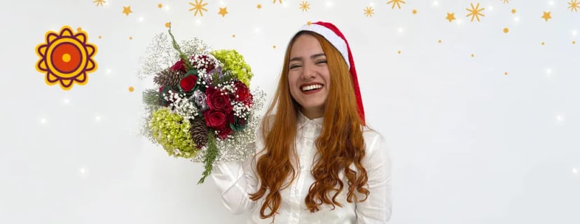 Woman in Santa hat holding Christmas bouquet with red roses, green hydrangeas, pinecones, mauve roses palette, soft pink roses, pastel flowers quotes.