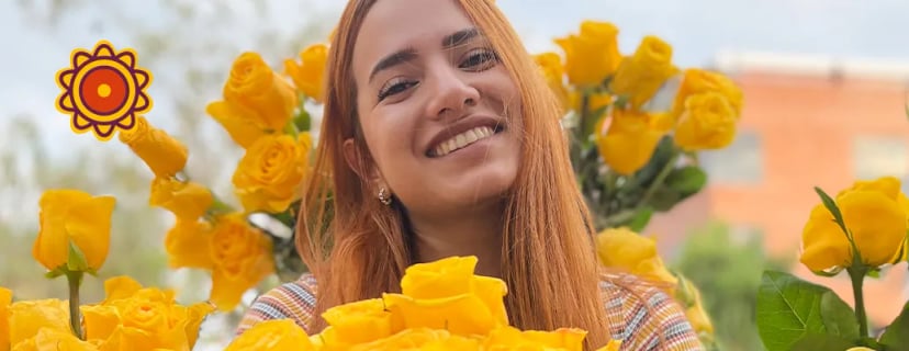 Woman holding a fresh bouquet of vibrant yellow Ecuadorian roses. Elegant peach roses for you, lavender lavish rose styles, green roses, pink roses bouquet.
