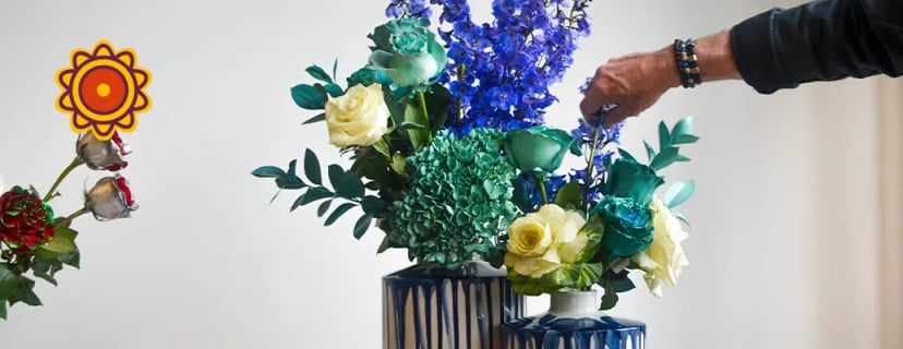 Floral arrangement with cream and teal roses, blue delphinium, and hydrangea for Mother's Day 2022 near me flowers delivery Los Angeles.